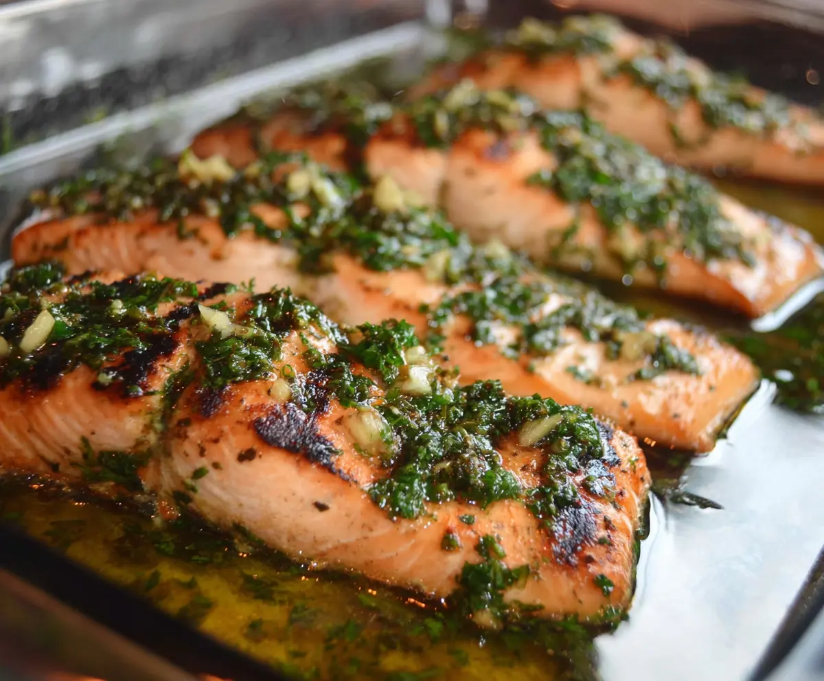 Delicious parsley garlic salmon served on a plate, showcasing vibrant green herbs and perfectly cooked fish.